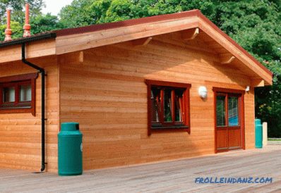 How to sheathe a wooden house outside - a review of materials